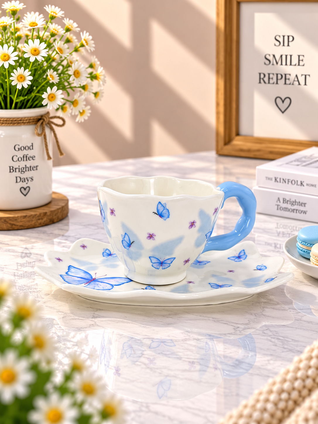 Blue butterfly ceramic coffee cup and saucer set, white base with blue butterfly pattern.